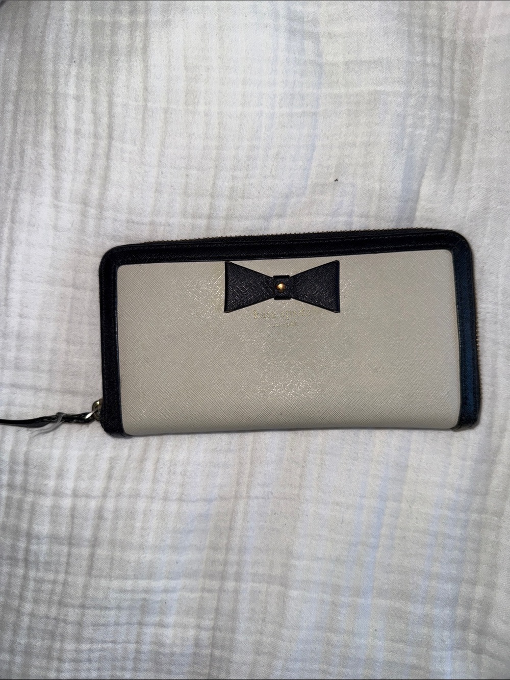 kate spade cream and black bow zip-around wallet
